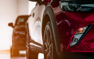New Luxury Suv Compact Car Parked In Modern Showroom For Sale C | McCormick Insurance Auto insurance